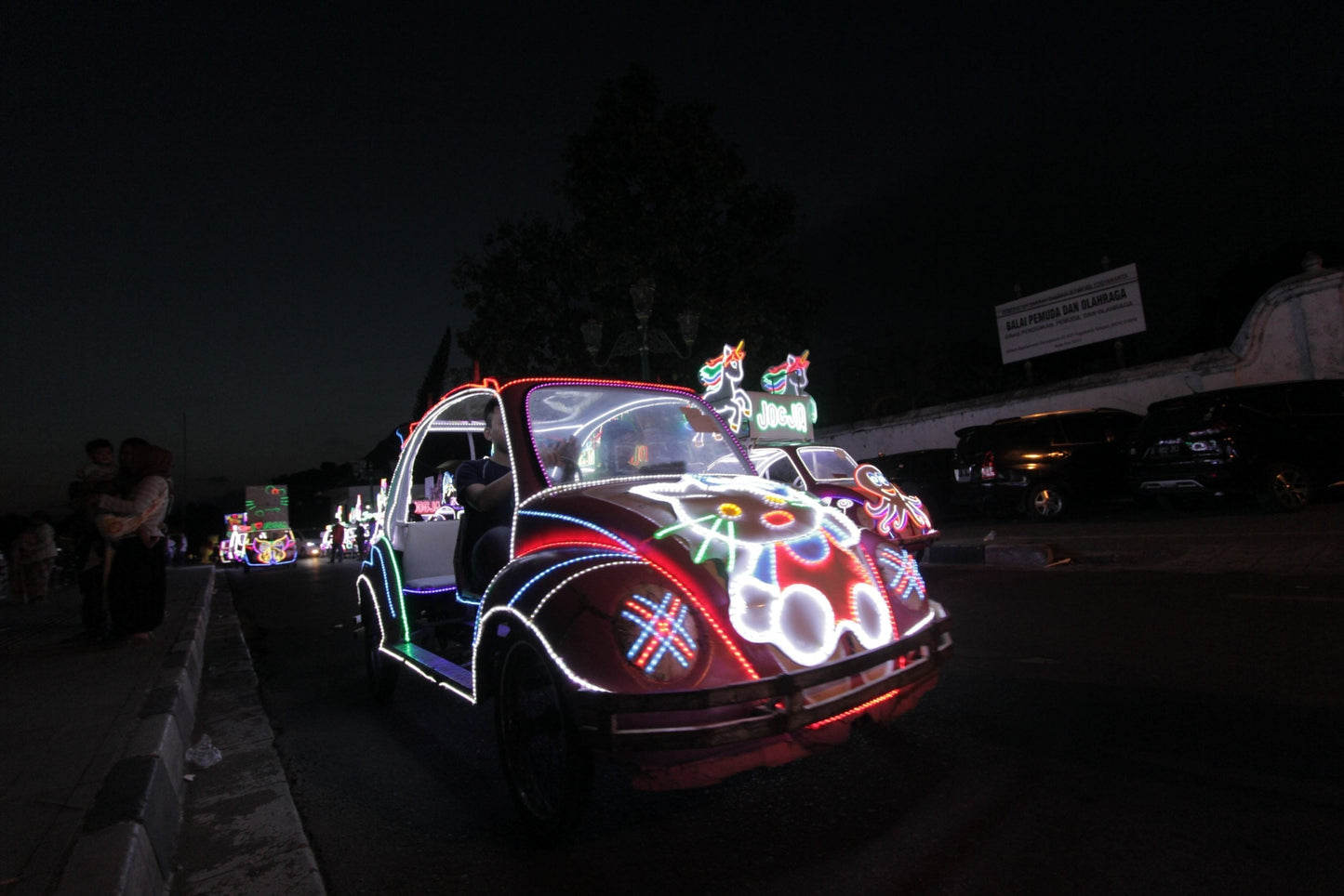 Photo of a Volkswagen Beetle decorated with festive lights