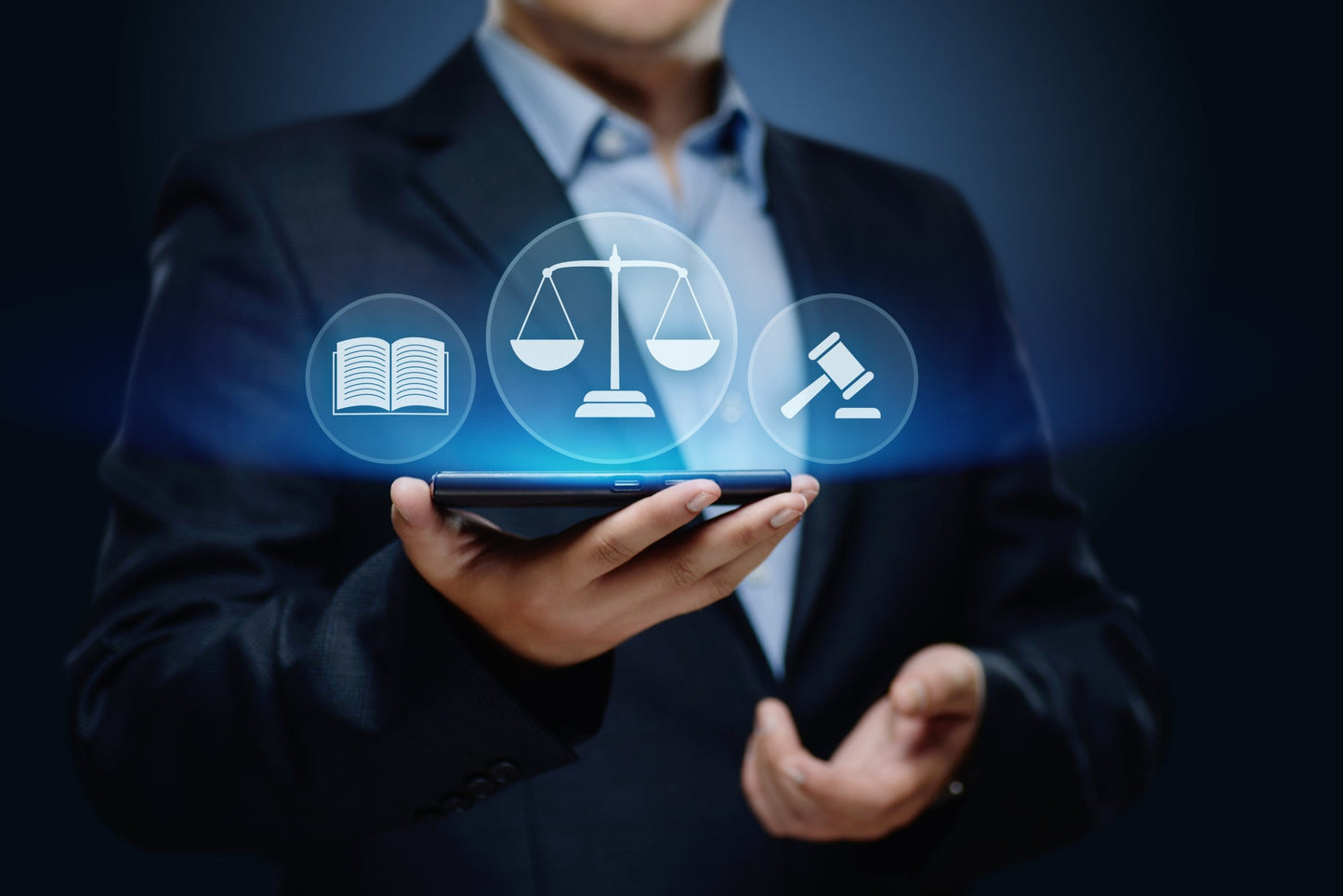 Image of a man in a suit holding a phone, which is radiating images associated with justice - a book, a scale and a gavel