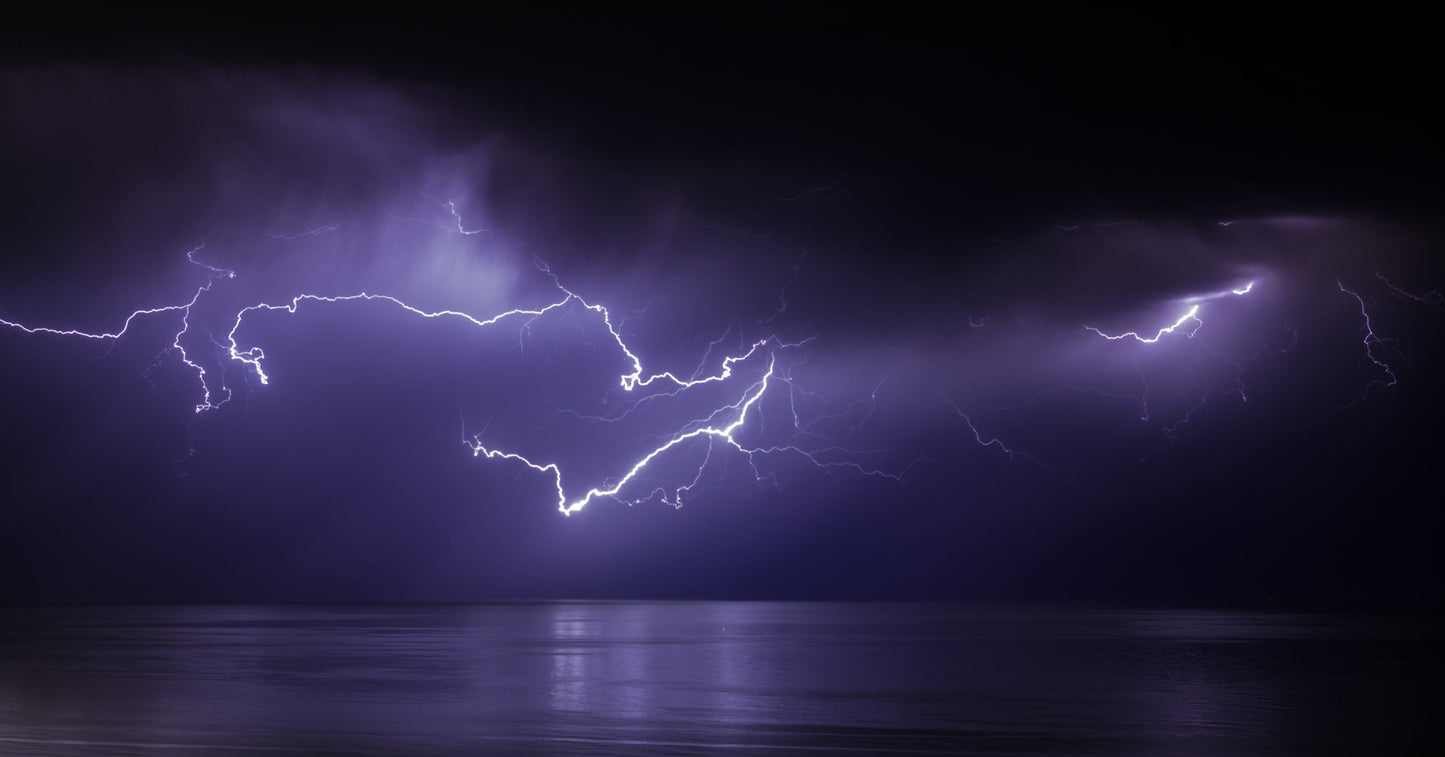 Image of a lightning storm over the ocean